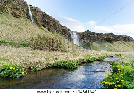 Seljalandsfoss is one of the best known waterfalls in Iceland. Seljalandsfoss is located in the South Region in Iceland right by Route 1