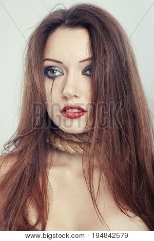 Female witch with slipknot on her neck