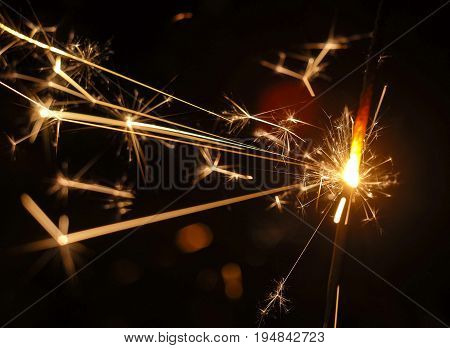 Close up fire spark with black background.