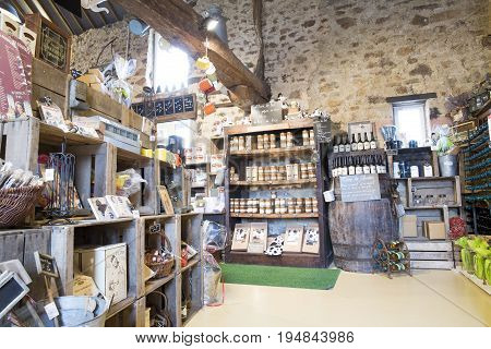 Valognes Normandy France - February 06 2014. Traditional typical delicatessen shop in Normandy. Shop of jams chutney alcohol biscuits pasta beer milk jam and retro products for decoration In wooden boxes