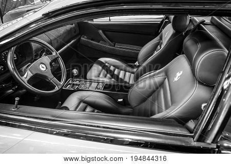 STUTTGART GERMANY - MARCH 18 2016: Cabin of sports car Ferrari F512 TR Testarossa 1993. Black and white. Europe's greatest classic car exhibition 