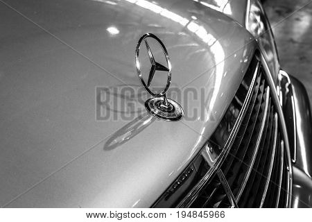 STUTTGART GERMANY - MARCH 18 2016: Hood ornament of Mercedes-Benz 300 SE (W140) close-up. Black and white. Europe's greatest classic car exhibition "RETRO CLASSICS"