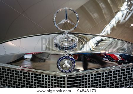 STUTTGART GERMANY - MARCH 18 2016: Hood ornament of Mercedes-Benz 220 SE (W128) close-up. Europe's greatest classic car exhibition 
