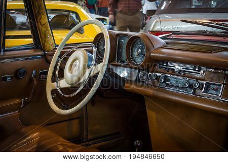STUTTGART GERMANY - MARCH 18 2016: Cabin of full-size luxury car Mercedes-Benz 280 SE 3.5 Coupe (W111) 1970. Europe's greatest classic car exhibition 