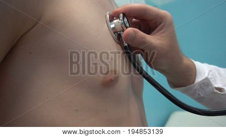 The doctor listening patient lung with stethoscope.
