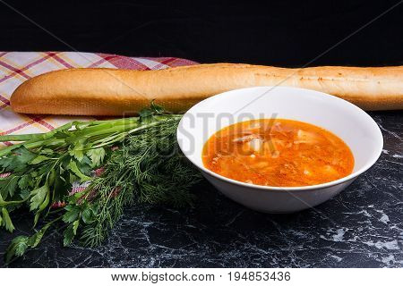 Vegetables And Meat In Red Beetroot Soup Or Borsch In White Plate On Dark Marble Background.
