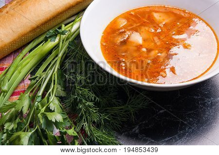 Vegetables And Meat In Red Beetroot Soup Or Borsch In White Plate On Dark Marble Background.