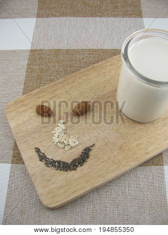 Almond milk and facial expression of rolled oats and chia seeds