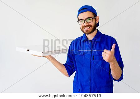 Pizza delivery service concept: delivery guy bringing pizza box
