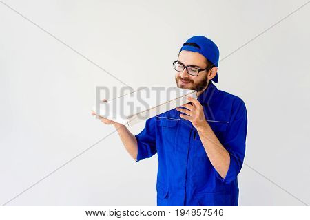 Pizza delivery service concept: delivery guy bringing pizza box