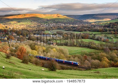 Passanger Train Passing Through British Countryside Near Greater Manchester England.