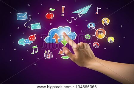 Female hand toucing mixed media icons with purple background