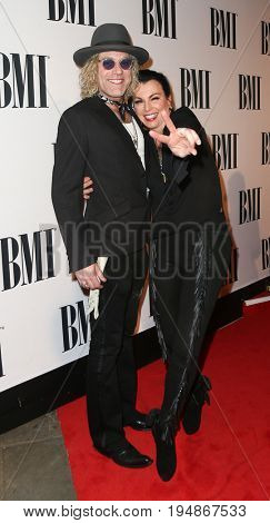 NASHVILLE, TN-NOV 3: Recording artist Big Kenny (L) and wife Christiev Carothers attend the 63rd annual BMI Country awards at BMI on November 3, 2015 in Nashville, Tennessee.