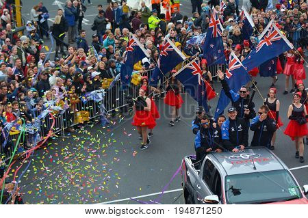 AUCKLAND - JULY 06 2017: Fans welcome home Team New Zealand and the Auld Mug America's Cup Trophy in downtown Auckland New Zealand.