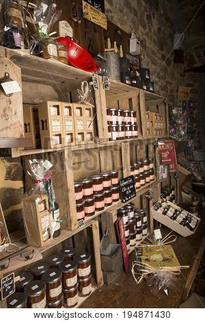 Valognes Normandy France - February 06 2014. Traditional typical delicatessen shop in Normandy. Shop of jams chutney alcohol biscuits pasta beer milk jam and retro products for decoration In wooden boxes