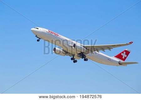 ZURICH - July 30:  A-330 Swiss airlines taking off at Terminal A of Zurich Airport on July 30, 2016 in Zurich, Switzerland. Zurich airport is home port for Swiss Air and one of the european hubs.