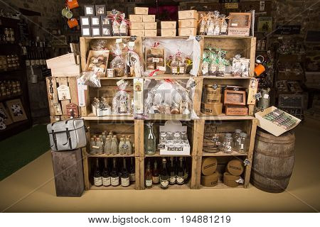 Valognes Normandy France - February 06 2014. Traditional typical delicatessen shop in Normandy. Shop of jams chutney alcohol biscuits pasta beer milk jam and retro products for decoration In wooden boxes