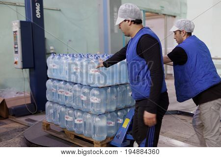 ST. PETERSBURG, RUSSIA - JUNE 29, 2017: Workers in the drinking water factory of Lider-Aqua  LTD. The factory is certified by regional quality certification program