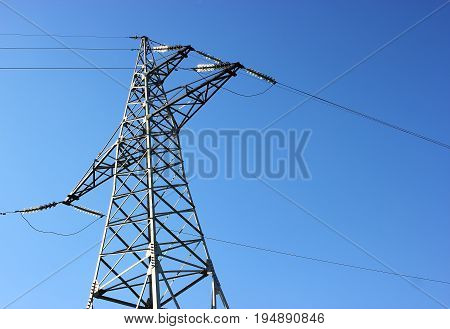 Transmission power tower electricity pylon . Steel lattice tower used to support an overhead power line