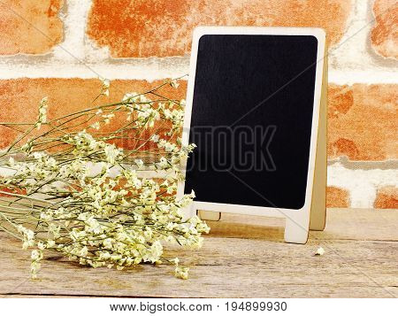 space of wooden background with flower bouquet decoration