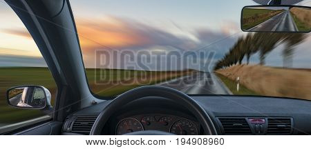 A view from behind the steering wheel of a car