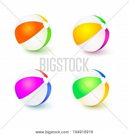 A set of colored inflatable beach balls. Realistic tri-colour bouncy ball with reflections and shadows isolated on white background. 3D illustration.
