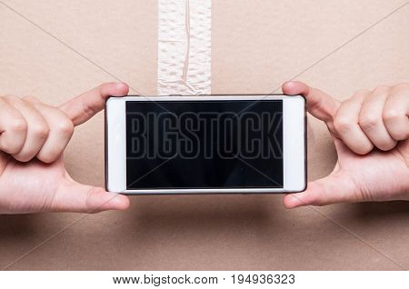 Close-up Of Man Showing Blank Smartphone Screen