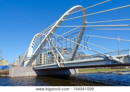 SAINT PETERSBURG RUSSIA - MAY 2 2017: Lazarevsky cable-stayed bridge across Malaya Nevka River St. Petersburg Russia