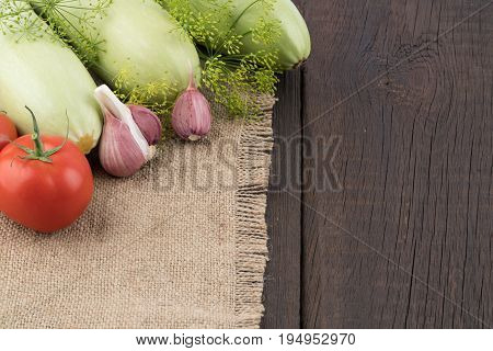 Ripe vegetables on an old wooden table. Selective focus.