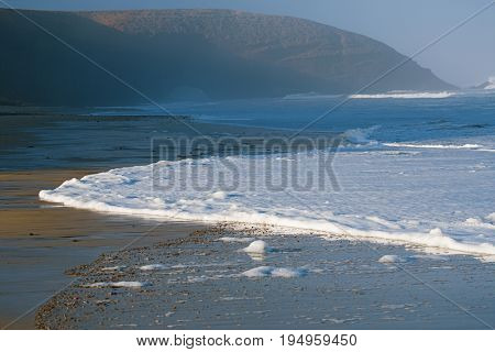 Legzira dramatic natural stone arches reaching over the sea, Atlantic Ocean, Morocco, Africa