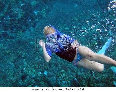 Person Snorkeling In Molokini Crater, Maui, Hawaii.