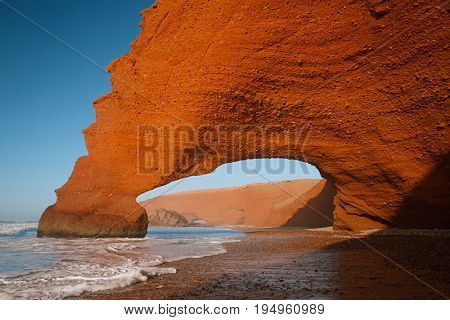 Legzira dramatic natural stone arches reaching over the sea, Atlantic Ocean, Morocco, Africa