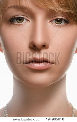 portrait of beautiful young woman close up on a light background