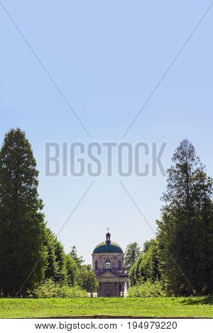 Old church of Exaltation 18th century near Pidhirtsi Castle between trees, Ukraine