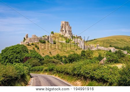 Wareham United Kingdom - June 20 2017: Ruins of Corfe Castle built in medieval times by William the Conqueror in the Isle of Purbeck in Dorset viewed from the village below. 