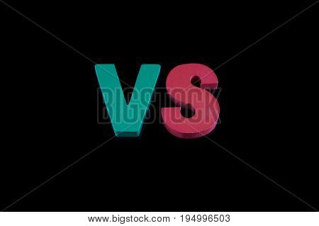 Letters VS on black background with copy space. The concept of making choice. Versus letters.