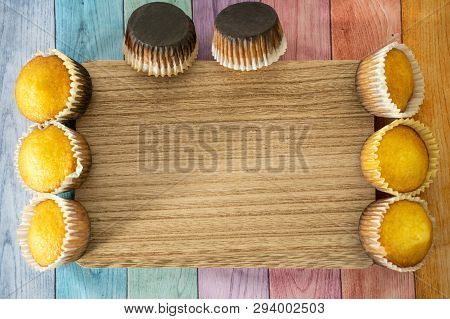 Burned Homemade Cornbread Muffins On A Pastel Wood Background, Room For Copy. Concept For Baking Mis