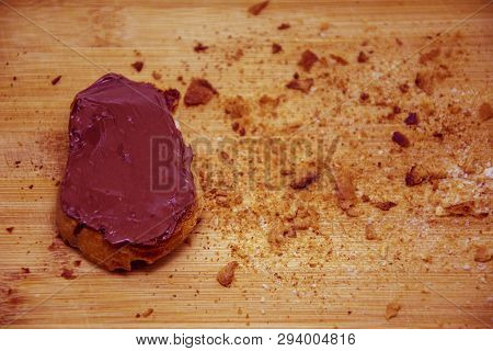 Bread Crumbs Around Chocolate On Toasted Bread, Chocolate Bread On Cutting Board With Breadcrumbs Ar