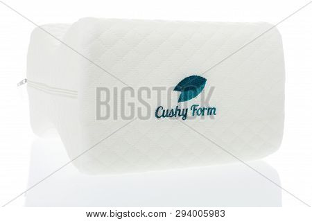 Winneconne, Wi -  7 April 2019: A Package Of Cushy From Memory Foam Knee Pillow On An Isolated Backg