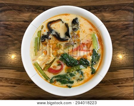 Shanghai Hot Sauce Noodles In Red Soup Bowl On Wood Table Background.