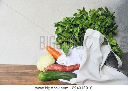 Zero Waste Use Less Plastic Concept / Fresh Vegetables Organic In Eco Cotton Fabric Bags On Wooden T