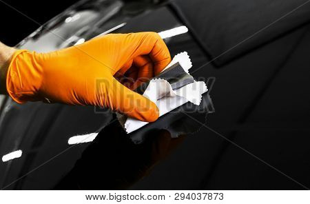 Car Polish Wax Worker Hands Polishing Car. Buffing And Polishing Vehicle With Ceramic. Car Detailing