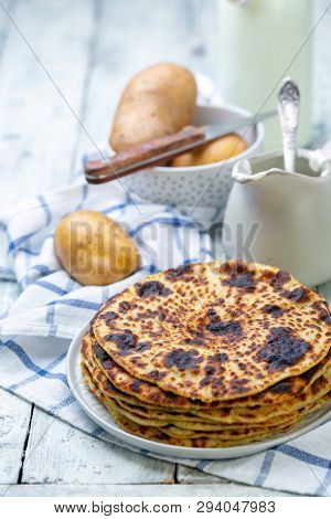 Norwegian Potato Pancakes Lefse With White Wooden Table, Selective Focus. Traditional Scandinavian C