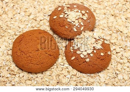 Oatcakes On Rolled Oats Background. Close Up.