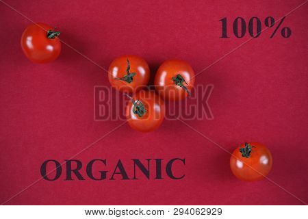 Tomatoes. 100 Percen Organic. Red Background. Close Up