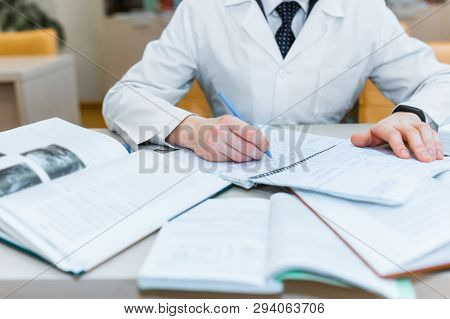 Background A Medical Student For Textbooks. The Study Of Surgery By A Man In A Tie In The Library