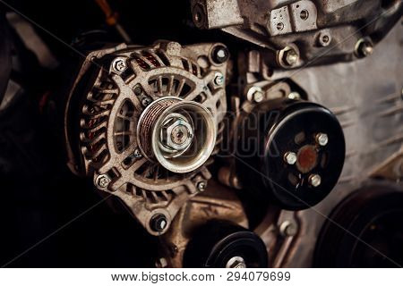 Disassembled Car Dirty Engine And Dynamo At Garage