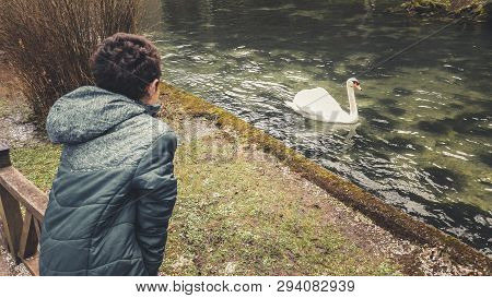 The Young Man Enjoys A Picturesque View Of The River And The Swamp.