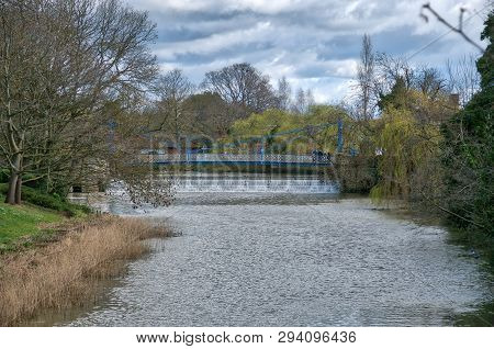 A Foot Bridge Crosses The River Learn Behind The Jephson Gardens Weir
