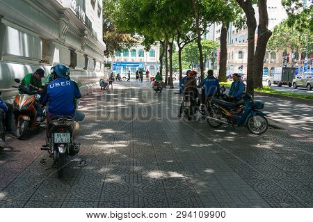 Ho Chi Minh City, Vietnam - August 24, 2017: Uber Scooter And Motorcycle Drivers Having Rest On Stre